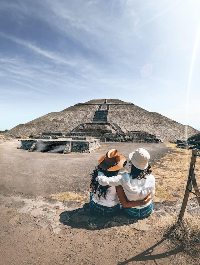 Girls sitting in front of the Sun pyramid in Teotihuacan